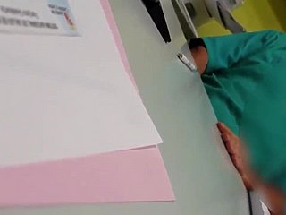 A doctor masturbates in front of a patient